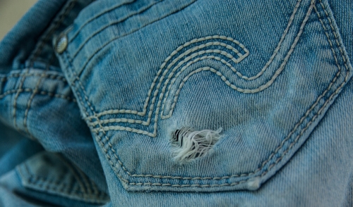 How to DIY Distress Your Jeans
