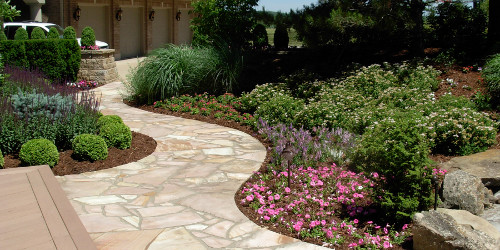 Natural stone walking path with floral accents