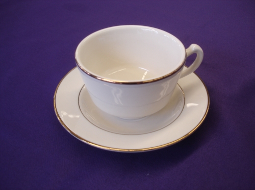Coffee cup and saucer with gold trim
