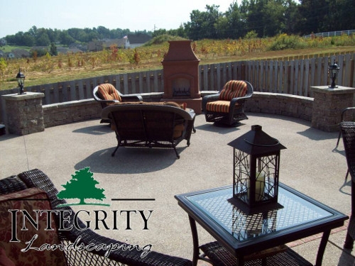 Aggregate Patio with Paver Wall Custom Fit to Pre-Fab Fireplace