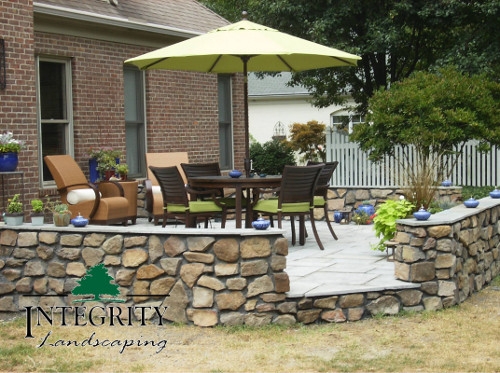 Natural Stone Patio with Stone Wall Surround