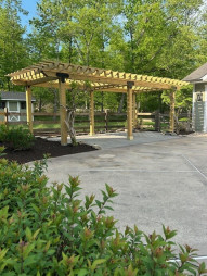 Our construction crew just completed this poolside flagstone terrace and pergola.
