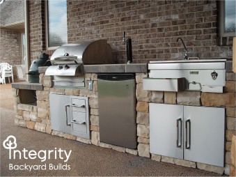 Outdoor Kitchen Complete with Grill, Smoker, Sink, and Beer Tap