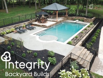 Sky View of Fenced in Pool with Diving Board