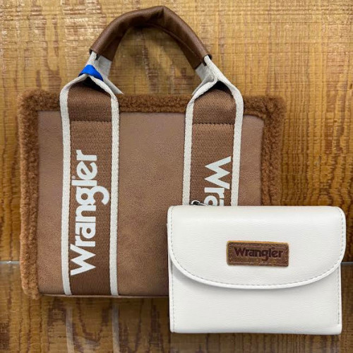 Brown tote bag with white Wrangler text, featuring contrasting handles, and a matching white wallet with a brown Wrangler label, on a wooden surface.